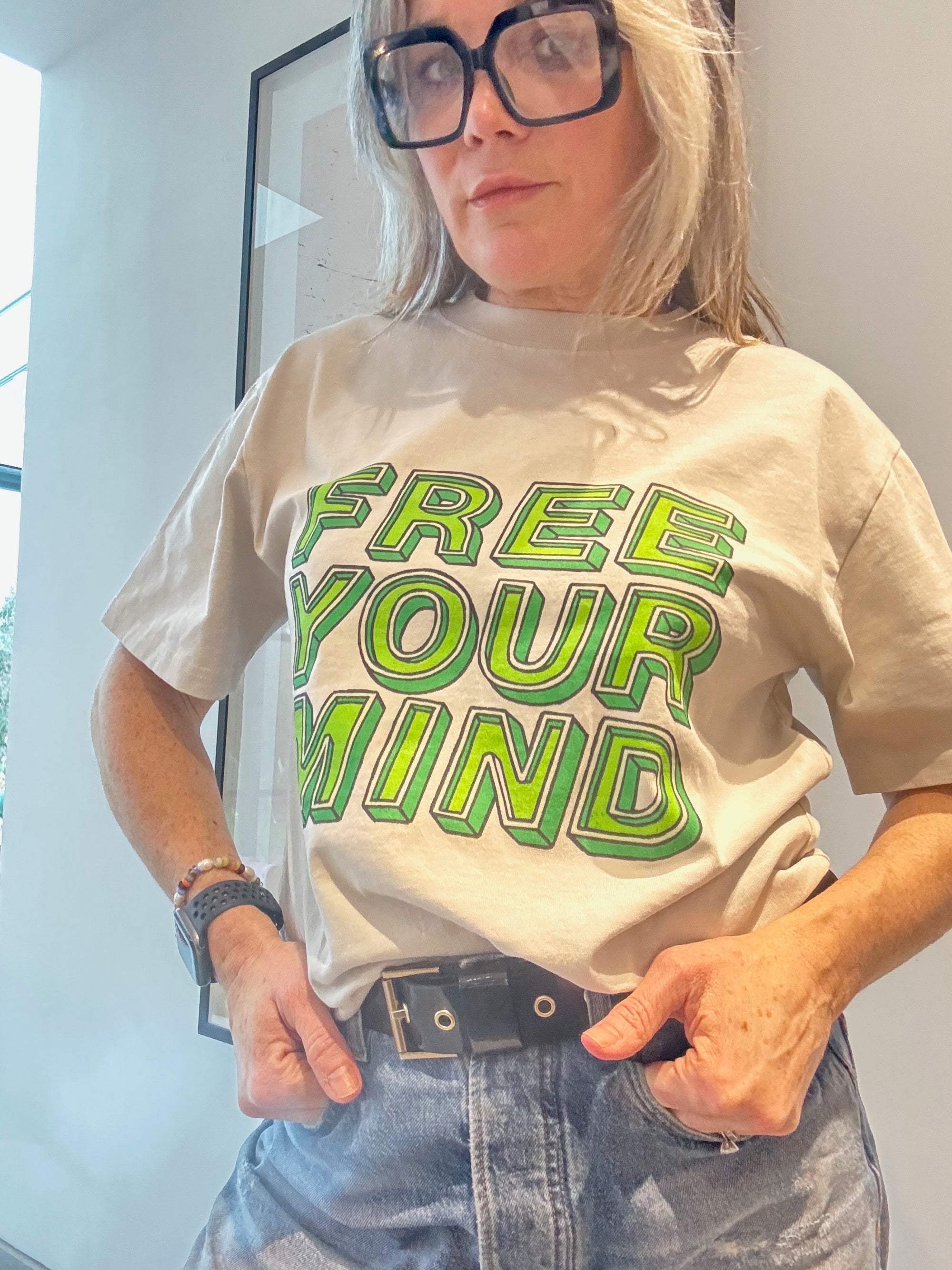 Woman wearing Free Your Mind Tshirt in Small